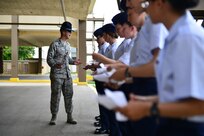 Staff Sgt. Joshua Hite, who was recently named Military Training Instructor of the Year, speaks with graduating Airmen from the 322nd Training Squadron Sept. 26, 2012, at Joint Base San Antonio, Lackland. (U.S. Air Force photo by Senior Airman Vernon Young)