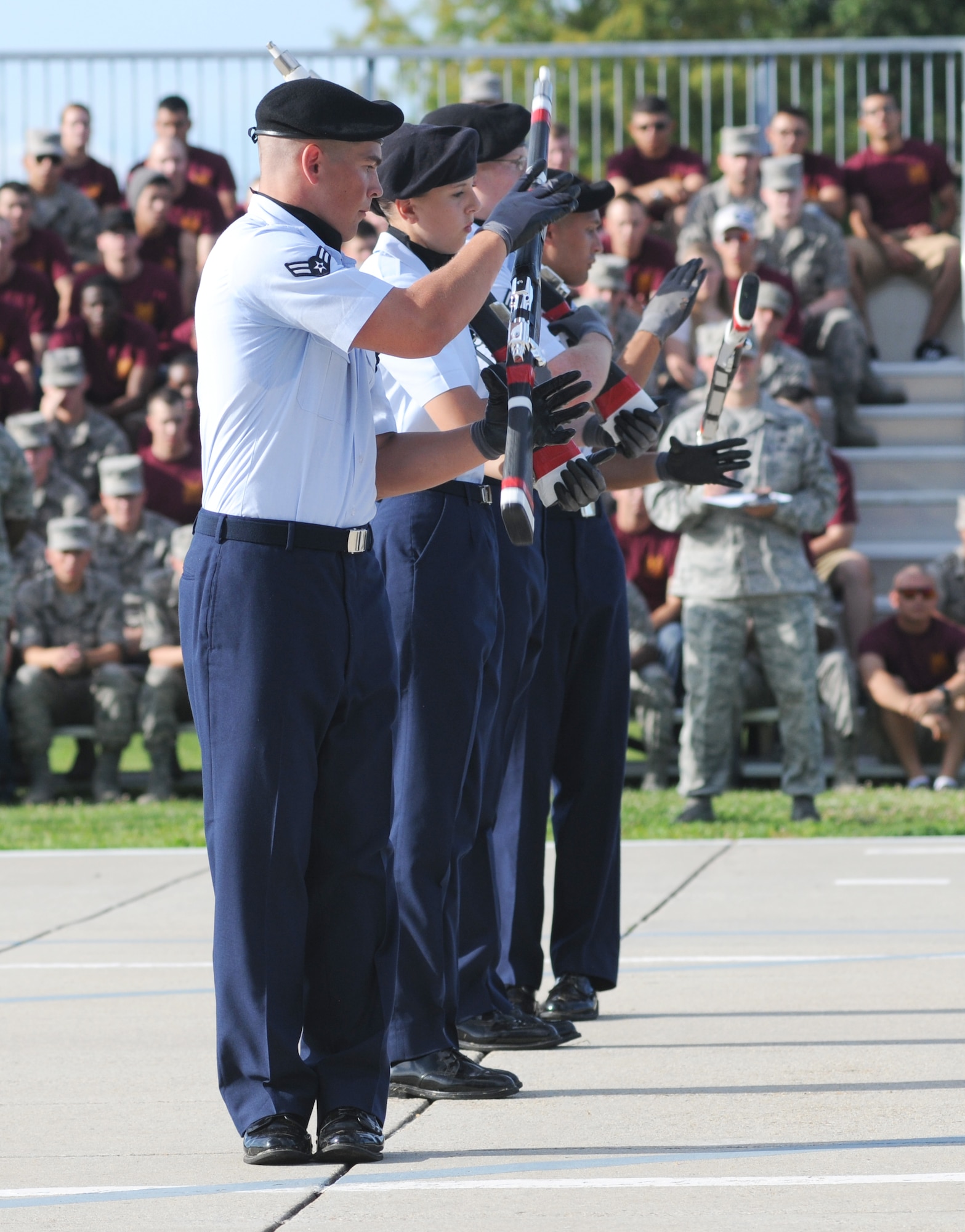 Members of the 335th Training Squadron freestyle drill team perform during the 81st Training Group drill down competition July 19, 2013, behind the Levitow Training Support Facility, Keesler Air Force Base, Miss.  The 335th TRS swept the competition, winning first place in every category to include open ranks, regulation, freestyle and overall.  (U.S. Air Force photo by Kemberly Groue)