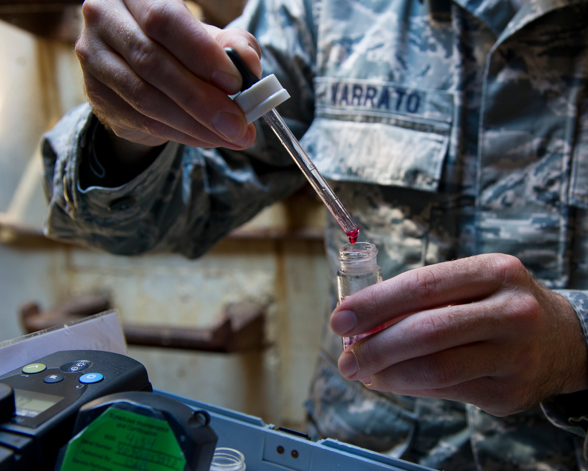 ALTUS AIR FORCE BASE, Okla. -- Staff Sgt. Marshall Varrato, 97th Medical Operations Squadron bioenvironmental engineering NCO in charge of readiness and training, adds Phenol Red Solution to a water sample during a routine water sampling on base. Phenol Red Solution is used to test Ph levels in the water. Members of the 97th MDOS bioenvironmental engineering flight conduct water samplings twice a month. The samples are collected and then delivered to a lab in Elk City, Okla. where they are tested for contaminants. (U.S. Air Force photo by Senior Airman Kenneth W. Norman / Released)