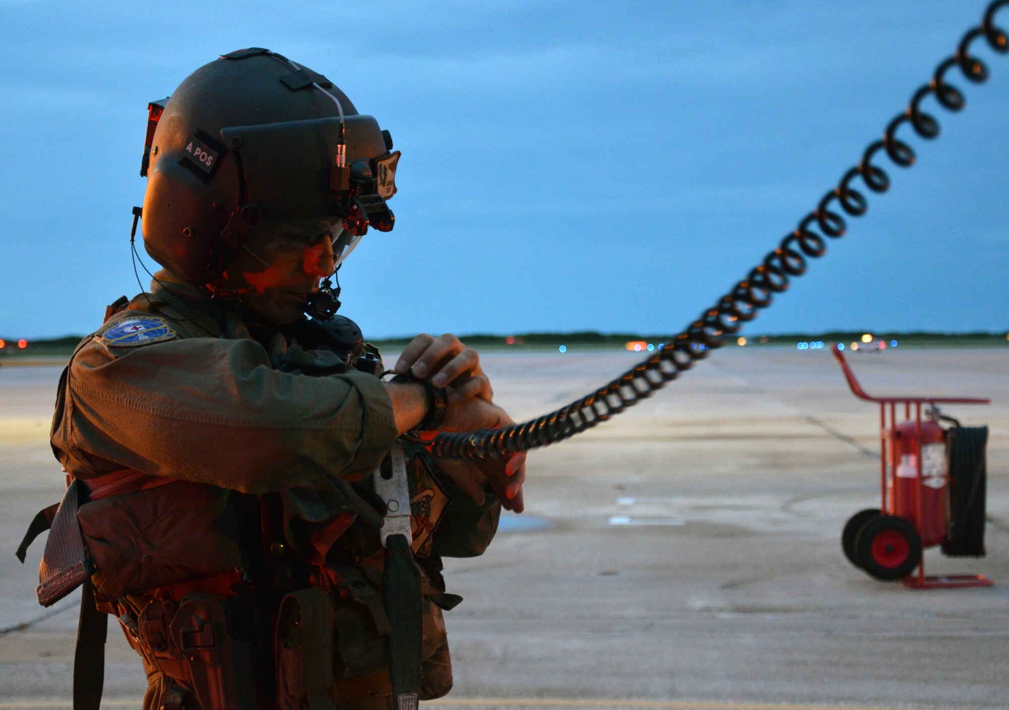 Tech. Sgt. Adrian Jarrin, a flight engineer with the 920th Rescue Wing, Patrick Air Force Base, Fla., checks the time as he prepares to fly over Florida’s Atlantic Coast to provide range clearing support for the Atlas V rocket launch July 19, 2013, Cape Canaveral Air Force Station, Fla. (U.S. Air Force photo/Tech. Sgt. Anna-Maire Wyant)