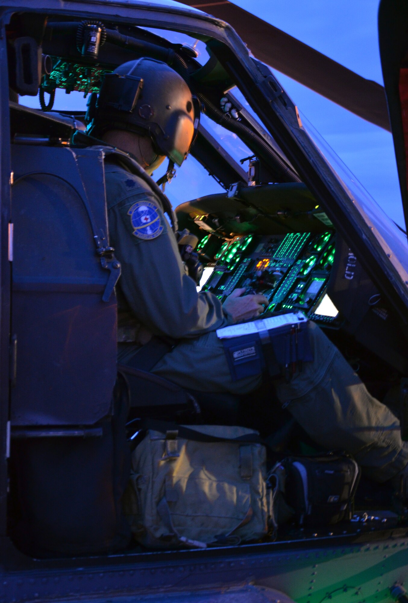 Lt. Col. Robert Haston, a 920th Rescue Wing Pave Hawk helicopter pilot at Patrick Air Force Base, Fla., prepares to fly over Florida’s Atlantic Coast to provide range clearing support for the Atlas V rocket launch July 19, 2013, Cape Canaveral Air Force Station, Fla. (U.S. Air Force photo/Tech. Sgt. Anna-Maire Wyant)
