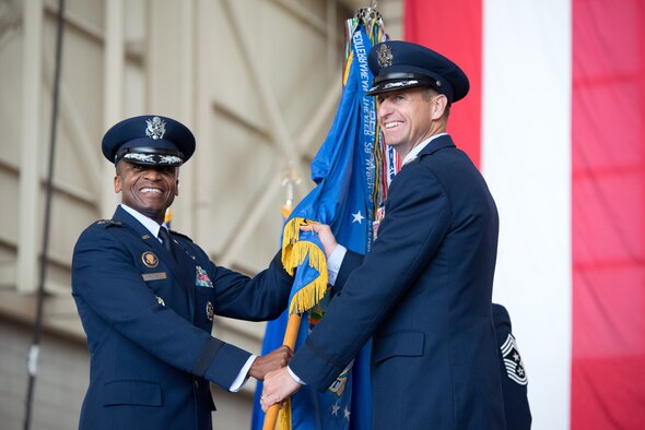 Col. Corey Martin, right, accepts command of the 60th Air Mobility Wing from Lt. Gen. Darren McDew, 18th Air Force commander, during a ceremony June 16, 2013 at Travis. (U.S. Air Force photo/Ken Wright)