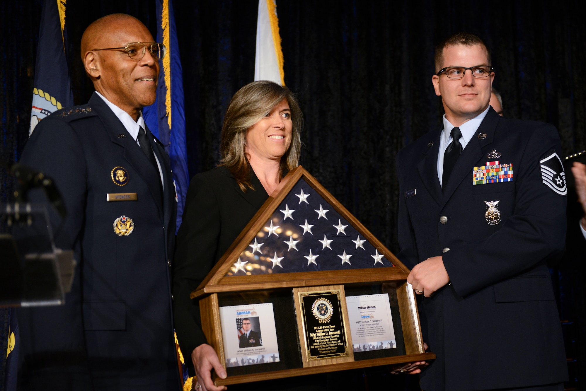 Master Sgt. William G. Janczewski II is presented the "Service Members of the Year" award by Gen. Larry O. Spencer, July 18, 2013, on Capitol Hill. Five service members, one from each branch of service including the Coast Guard, received the award from the newspaper publisher Military Times. (U.S. Army photo/C. Todd Lopez)