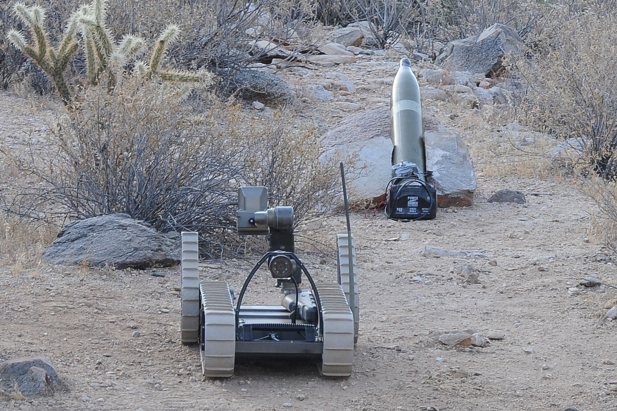 A 56th CES EOD robot approaches a simulated improvised explosive device during training. The exercise simulated real-world scenarios and conditions EOD members may encounter on real-world deployments. (U.S. Air Force photo/Airman 1st Class James Hensley)