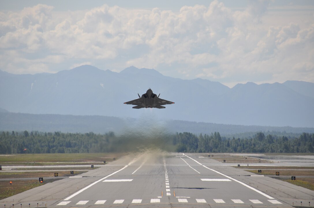An F-22 Raptor takes off after being hot-pit refueled July 13, 2013, at Joint Base Elmendorf-Richardson, Alaska. The Raptors were flown by Reserve pilots assigned to the 302nd Fighter Squadron during the 477th Fighter Group’s monthly training weekend. During the week, the 477th Fighter Group, Alaska's only Reserve unit, integrates with the active duty 3rd Wing. (U.S. Air Force/Tech. Sgt. Dana Rosso)