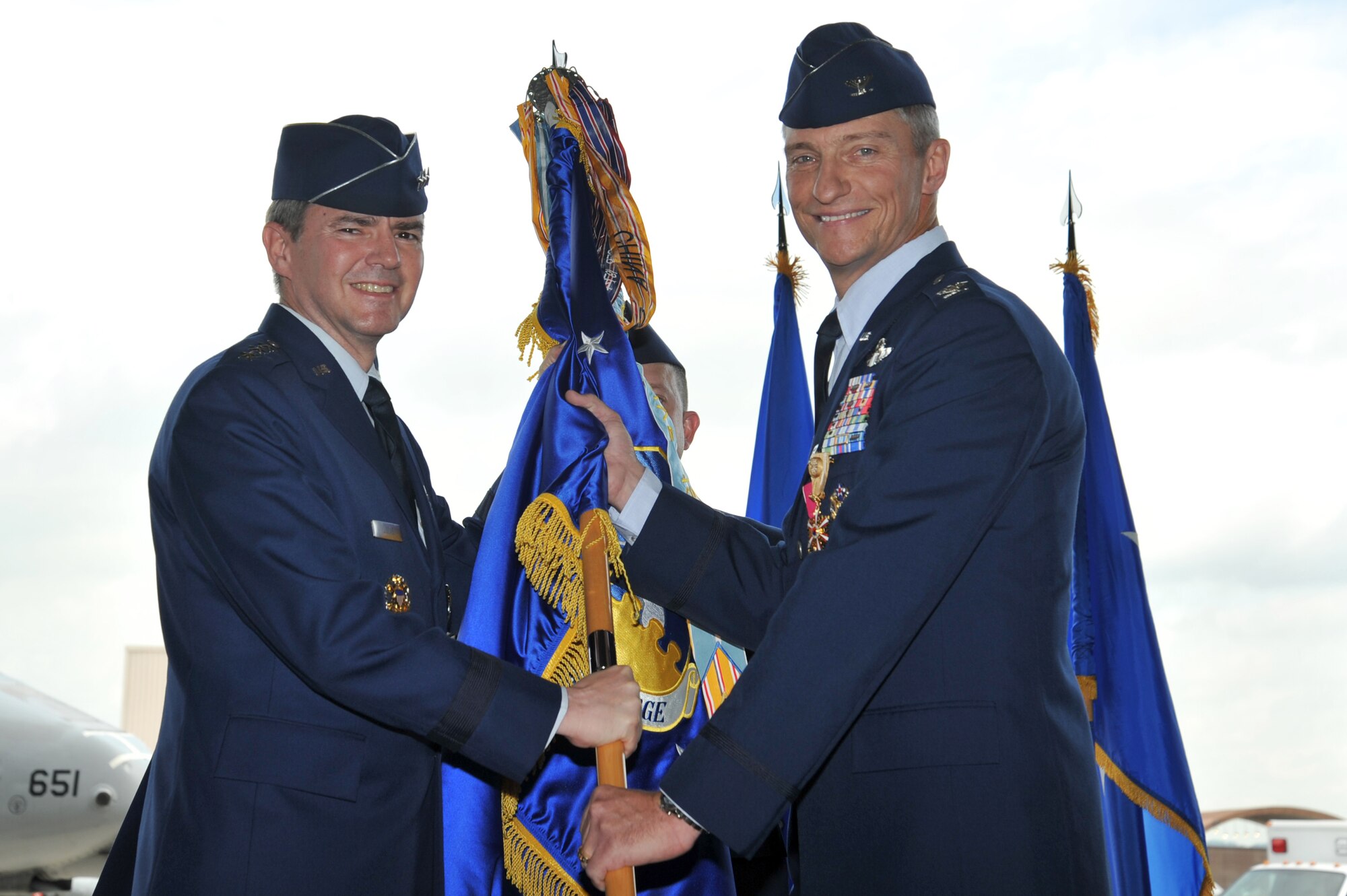 Col. Patrick McKenzie relinquishes command of the 51st Fighter Wing during a change of command ceremony at Osan Air Base, Republic of Korea, July 19, 2013.   McKenzie has served as the 51st FW's commander since July 14, 2011. (U.S. Air Force photo/Staff Sgt. Emerson Nuñez)