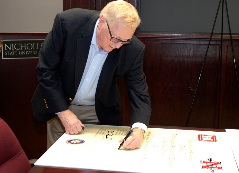 Nicholls State President Dr. Stephen Hulbert signs the Memorandum of Agreement with the U.S. Army Corps of Engineers, New Orleans District, July 17, 2013.