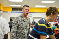 A trainee gets his instructions loud and clear from Staff Sgt. Joshua Hite after arriving to the 322nd Training Squadron for basic military training, Sept. 11, 2012, at Joint Base San Antonio-Lackland. (U.S. Air Force photo by Staff Sgt. Vernon Young Jr.)