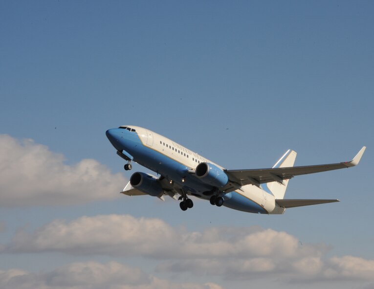 An Air Force Reserve Command C-40C bring wheels up as it flies a mission.  The 932nd Airlift Wing at Scott Air Force Base has three of the blue, white and gold aircraft.  (U.S. Air Force photo/Maj. Stan Paregien) 