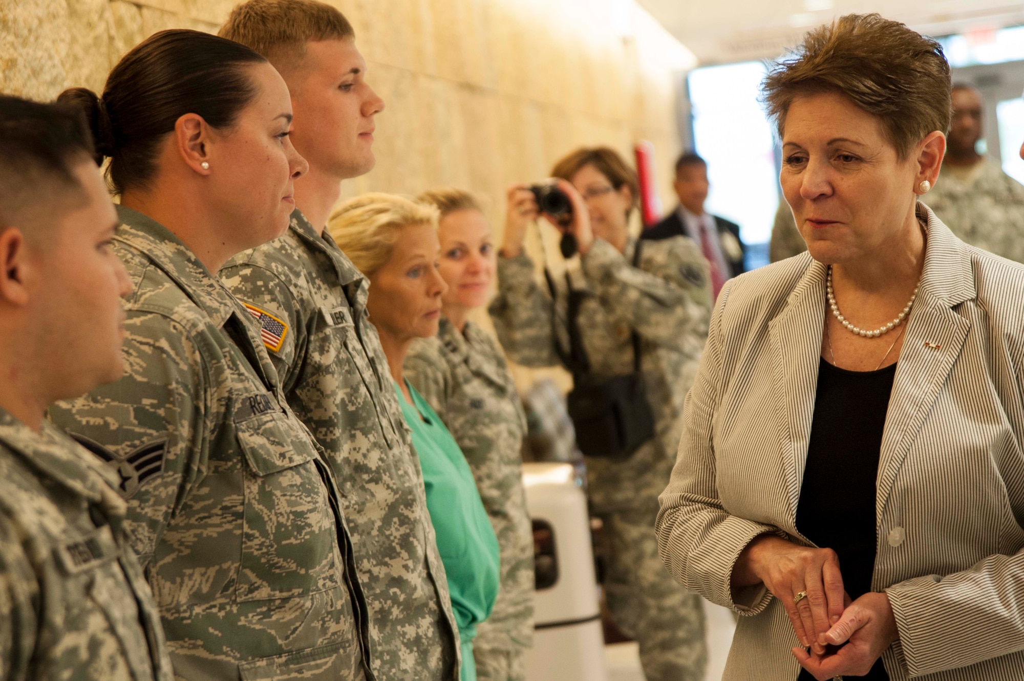 JOINT BASE SAN ANTONIO-FORT SAM HOUSTON, Texas – The honorable Jessica L. Wright, Acting Under Secretary of Defense for Personnel and Readiness, recognizes outstanding medical staff members July 17 during a visit to the San Antonio Military Medical Center at Joint Base San Antonio-Fort Sam Houston. Wright is deputy senior policy advisor to the Secretary of Defense on recruitment, career development, pay and benefits for 1.4 million active-duty military personnel, 1.3 million Guard and Reserve personnel, 680,000 Defense Department civilians. She is responsible for overseeing the overall state of military readiness. SAMMC was one stop in a three-day orientation visit to JBSA installations. (U.S. Air Force photo/Staff Sgt. Corey Hook)