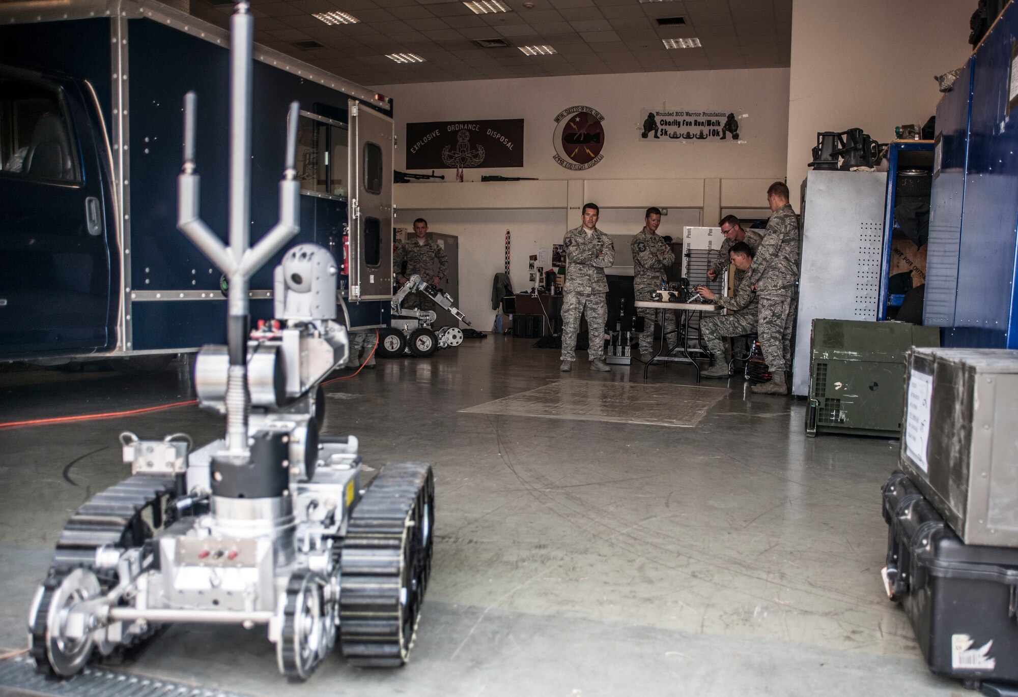Col. Craig Wills, 39th Air Base Wing commander, receives training on a 39th Civil Engineer Squadron explosive ordnance disposal robot from EOD members during the commander’s immersion with the EOD flight July 18, 2013, at Incirlik Air Base, Turkey. Wills tested the robot’s capabilities by removing a golf ball from one location and placing it flawlessly onto a separate location. (U.S. Air Force photo by Senior Airman Anthony Sanchelli/Released)