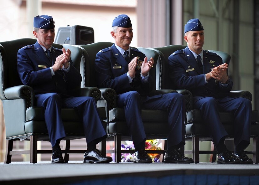 Lt. Gen. Jan-Marc Jouas, 7th Air Force commander, Col. Patrick McKenzie, outgoing 51st Fighter Wing commander, and Col. Brook Leonard, incoming 51st FW commander, applaud during the 51st FW’s change of command ceremony at Osan Air Base, Republic of Korea, July 19, 2013. Jouas served as the presiding officer of the ceremony, where hundreds of Airmen from across the base, local community members, and distinguished visitors came to the ceremony to honor the outgoing commander and welcome the incoming commander. (U.S. Air Force photo/Senior Airman Siuta B. Ika)