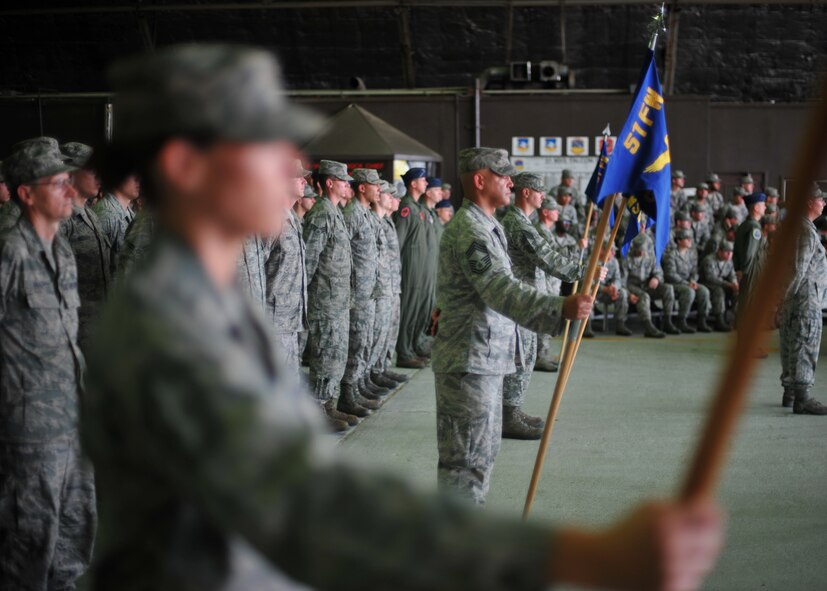 Members of the 51st Fighter Wing stand at parade rest during the 51st FW’s change of command ceremony at Osan Air Base, Republic of Korea, July 19, 2013. During the ceremony, Col. Patrick McKenzie relinquished command of the 51st FW to Col. Brook Leonard. In Leonard’s previous assignment, he served as the 451st Expeditionary Operations Group commander at Kandahar Airfield, Afghanistan. (U.S. Air Force photo/Senior Airman Siuta B. Ika)