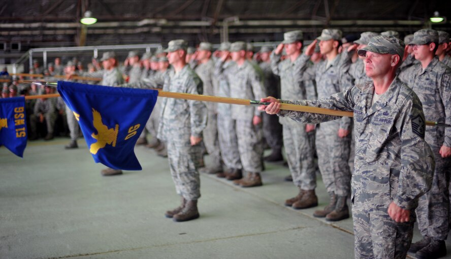 Members of the 51st Fighter Wing render a salute during the 51st FW’s change of command ceremony at Osan Air Base, Republic of Korea, July 19, 2013. Hundreds of Airmen from across the base, local community members, and distinguished visitors came to the ceremony to honor the outgoing commander, Col. Patrick McKenzie, and welcome the incoming commander, Col. Brook Leonard. (U.S. Air Force photo/Senior Airman Siuta B. Ika)