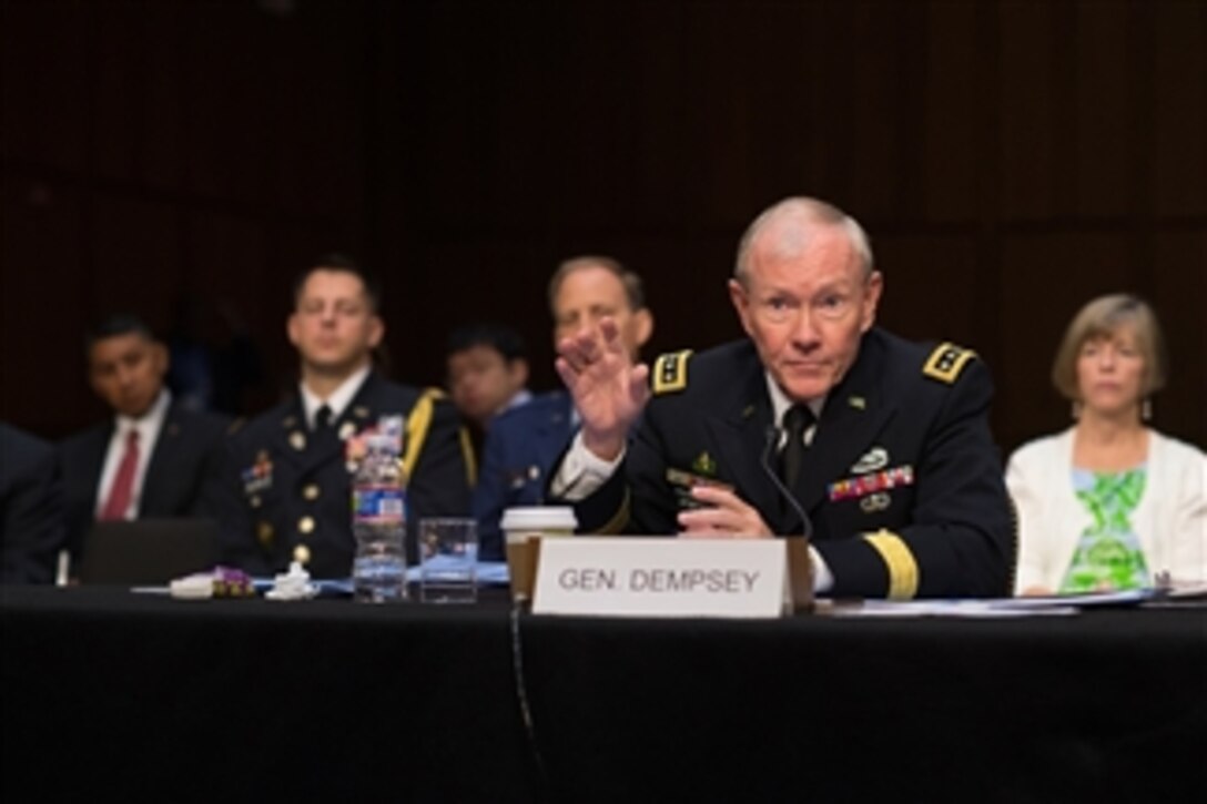 Chairman of the Joint Chiefs of Staff Gen. Martin E. Dempsey answers a senator’s question during his confirmation hearing before the Senate Armed Services Committee in the U.S. Senate Hart Building in Washington, D.C., on July 18, 2013.  President Obama has nominated Dempsey for a second two-year term as chairman.  