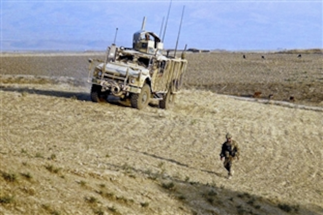 A U.S. soldier provides security from the gunner's turret on a mine-resistant, ambush-protected vehicle during a patrol in northern Kunduz province, Afghanistan, July 15, 2013.