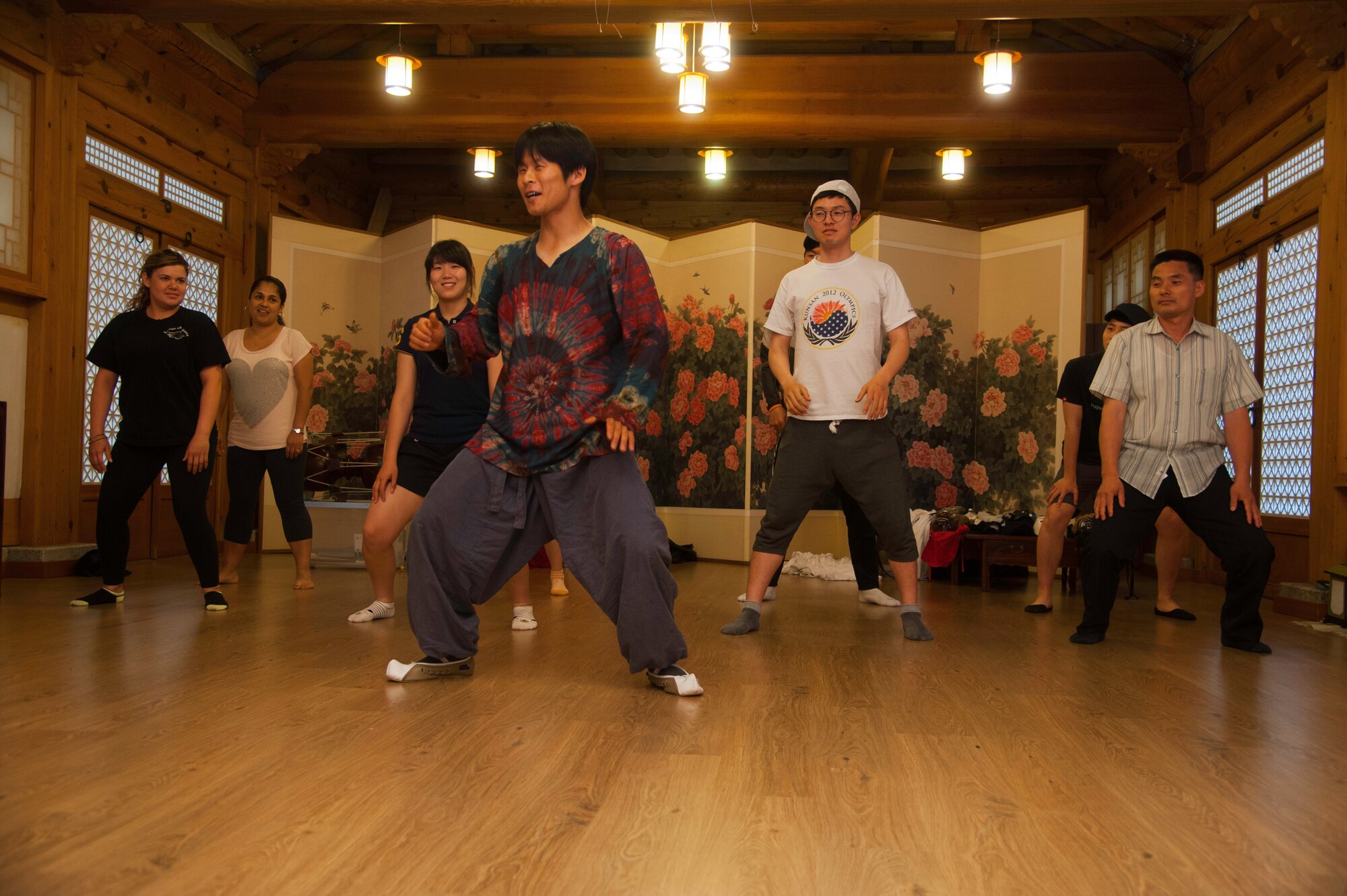 Eighth Fighter Wing and Republic of Korea 38th Fighter Group airmen participate in a masked dancing class during their trip to Jeonju Han-ok Village, ROK, June 11, 2013. More than 40 U.S. and ROK airmen participated in the culture experience program, which was designed to foster cross-cultural communications.  (U.S. Air Force photo by Senior Airman Jessica Haas/ Released)