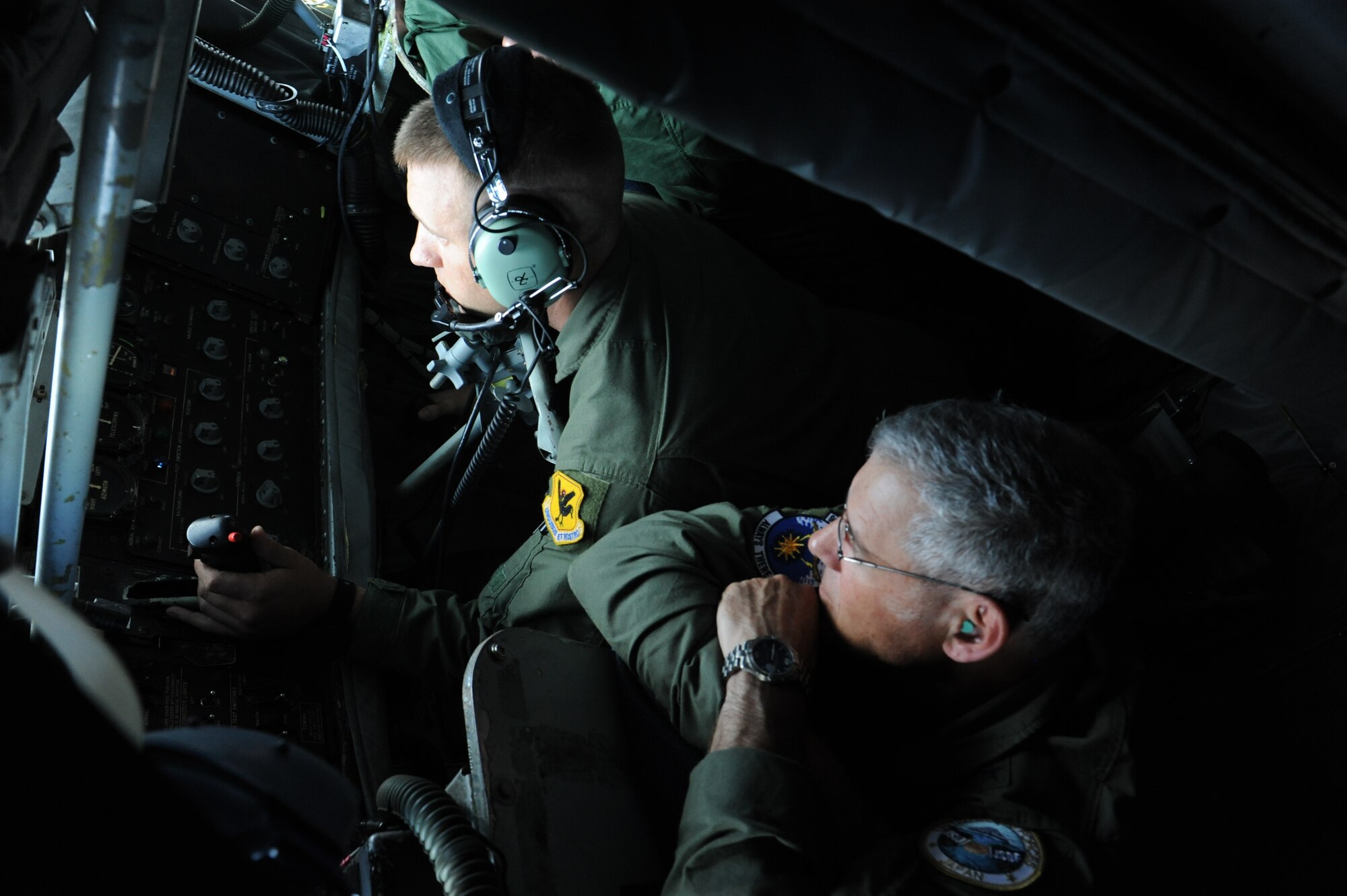 U.S. Air Force Lt. Gen. Sam Angelella, U.S. Forces Japan and 5th Air Force commander, watches Staff Sgt. Chad Holloway, 909th Air Refueling Squadron boom operator, refuel a Japan Air Self Defense Force F-15J jet during a joint refueling mission over the Pacific Ocean, July 11, 2013. The bilateral refueling mission between the 909th ARS and JASDF pilots gave both services the opportunity to work together in an operational environment in preparation for an upcoming training exercise, Red Flag Alaska. (U.S. Air Force photo by Airman 1st Class Malia Jenkins/Released)         