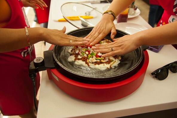 Eighth Fighter Wing and Republic of Korea 38th Fighter Group airmen learn to make Korean-style pizza during a trip to Sunchang Gochujang Village, ROK, June 10, 2013. Korean-style pizza is similar to American style with the exception of the dough and sauce. (U.S. Air Force photo by Senior Airman Jessica Haas/ Released)