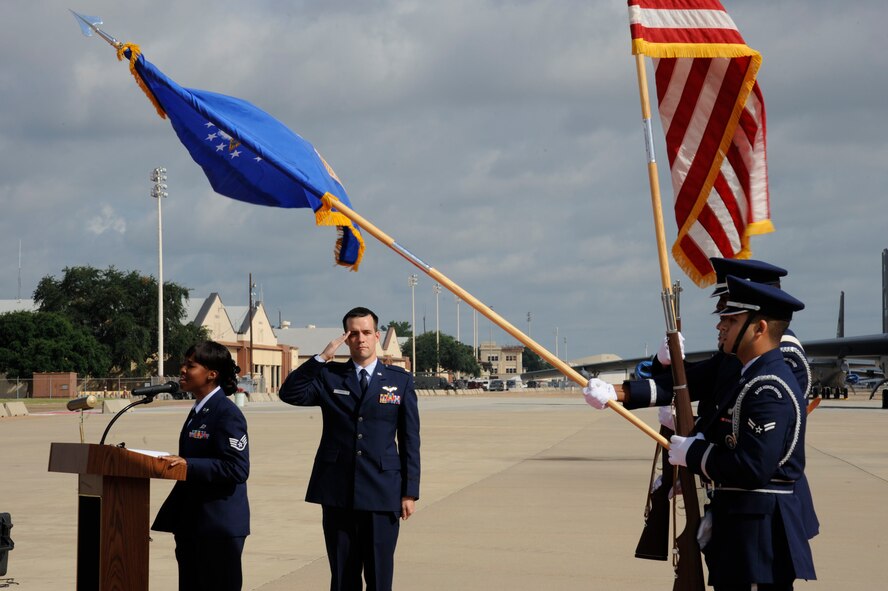 Staff Sgt. Giavonia Fields, Air Force Global Strike Command, sings the national anthem during a remembrance ceremony for the crew of RAIDR 21 on Barksdale Air Force Base, La., July 21, 2013. The ceremony included the unveiling of a granite placard which included the names of the RAIDR 21 crewmembers. (U.S. Air Force photo/Airman 1st Class Andrew Moua)