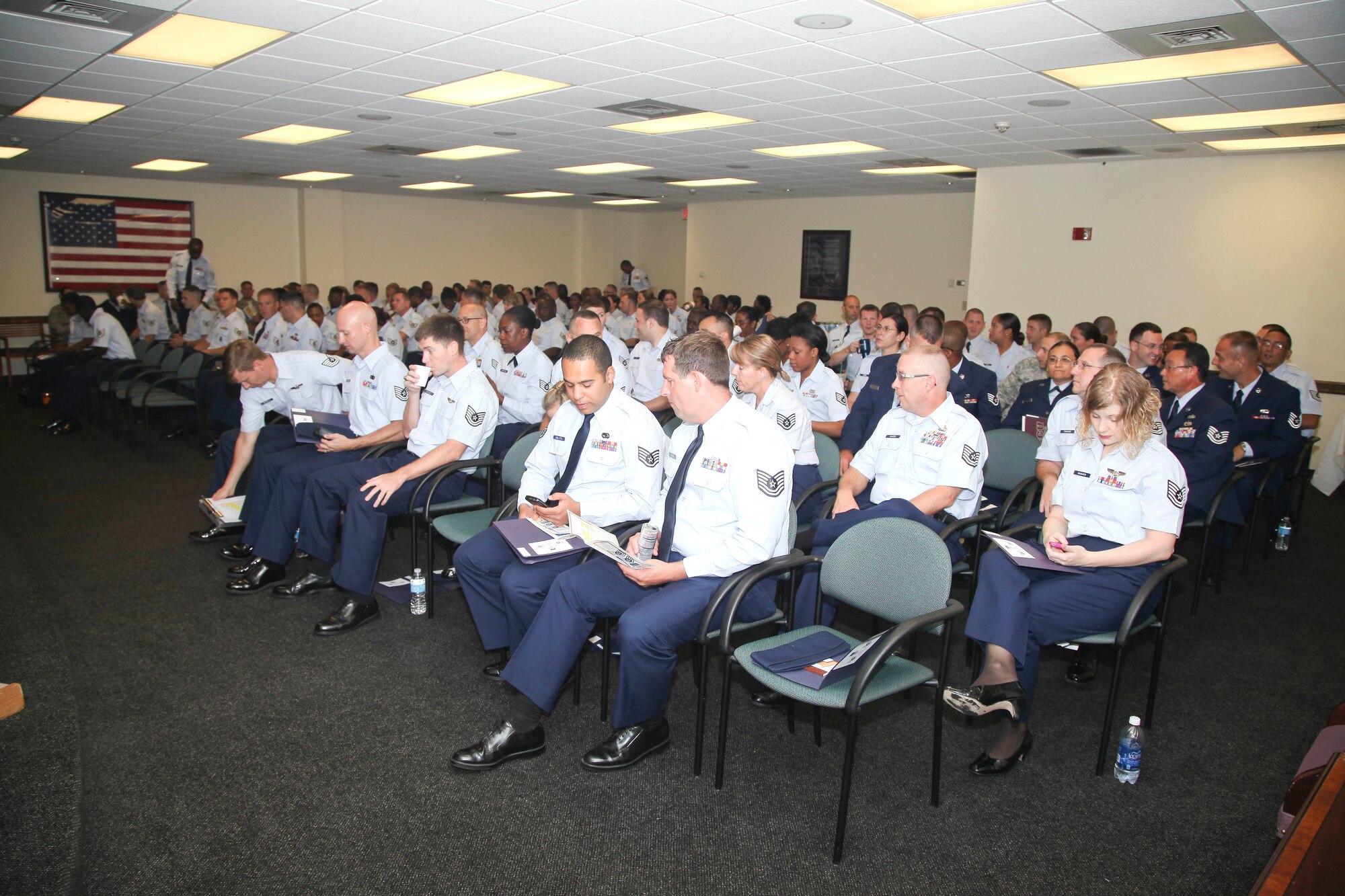 A group of Airmen gather the for opening briefings before the start of the junior NCO training event Saturday in the building 60 auditorium here at Joint Base Charleston, S.C. More than 130 JB Charleston Airmen registered for the event, which taught them valuable tools to help them become the Air Forces next generation of successful senior leaders. (U.S. Air Force photo by Staff Sgt. Rashard Coaxum/released) 