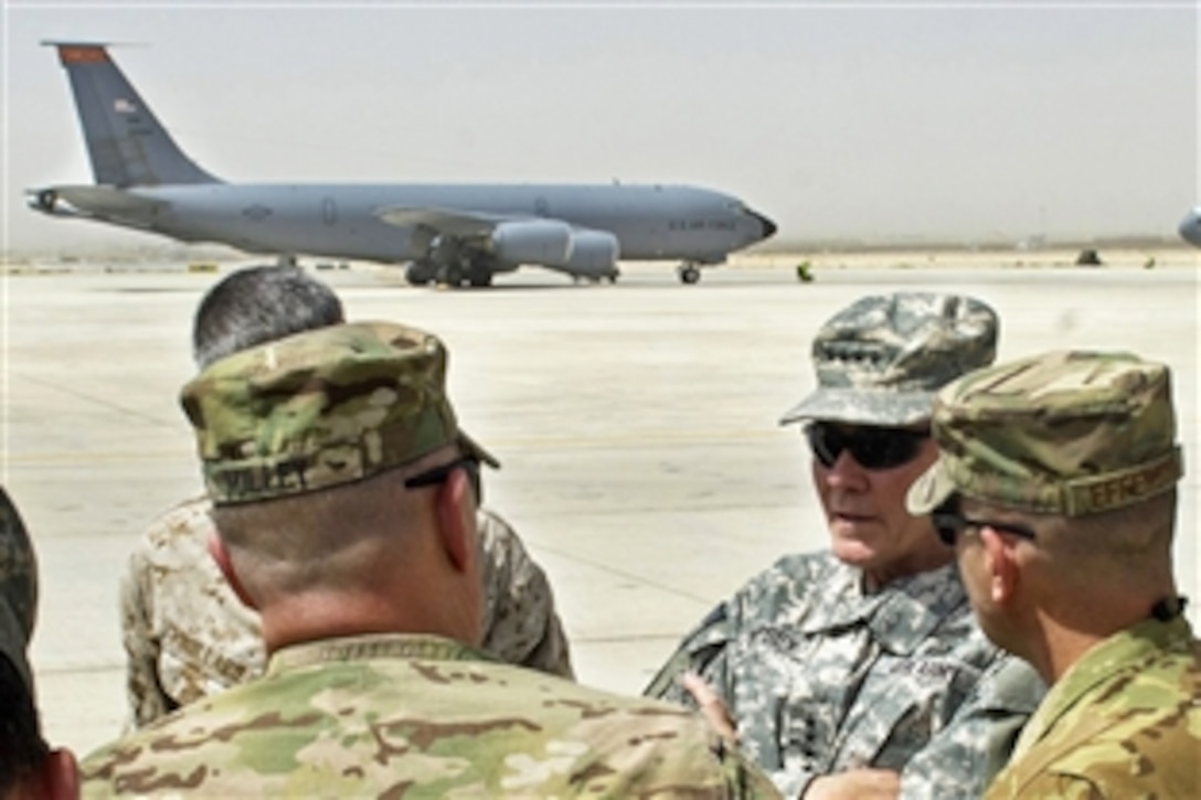 U.S. Army Gen. Martin E. Dempsey, chairman of the Joint Chiefs of Staff, discusses the KC-135 Stratotanker refueling mission with leaders from Regional Command North in Mazar-i-Sharif, Afghanistan, July 21, 2013. Dempsey also met with U.S. and allied troops.