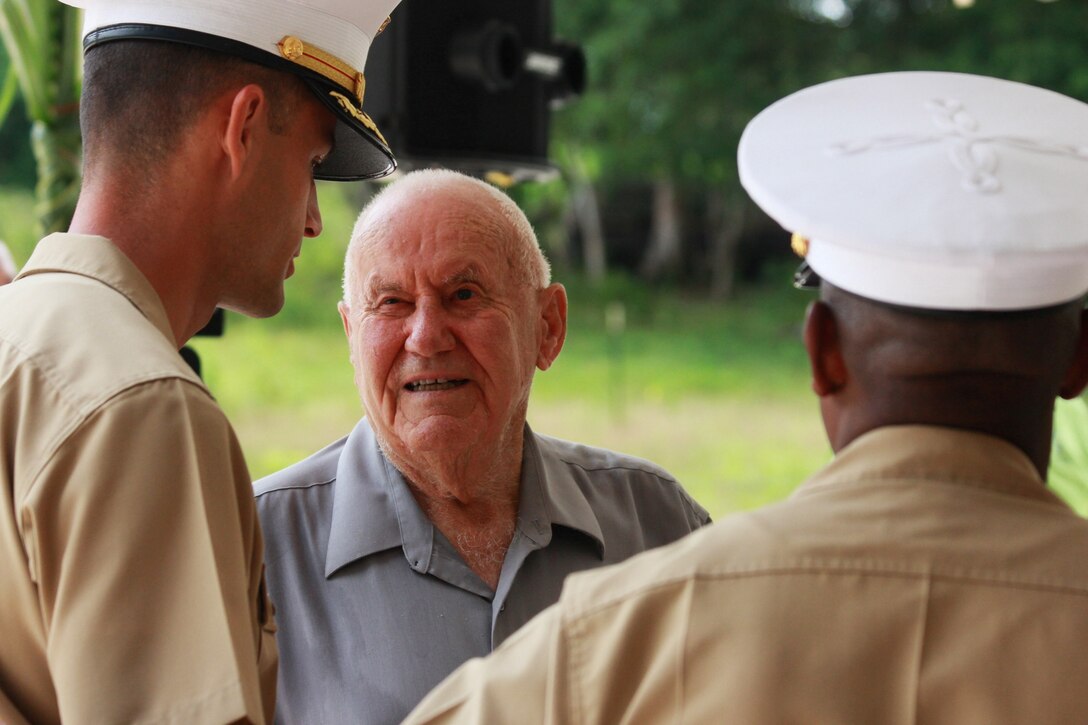 Major Christopher Merrill, a Wyoming native and Operations officer with Marine Corps Activity Guam, speaks with William Mays, a Marine who fought on Guam in 1944 during the liberation, at the Chagui’an Massacre memorial event July 16 in Yigo, Guam.  On this site, Japanese fighters massacred a group of Chamorro men after forcing them to move supplies across the island.  The ceremony was one of many held across the island to celebrate the liberation of the island from Japanese oppression and occupation in 1944.  (Official U.S. Marine Corps photo by Sgt. John Raufmann)  