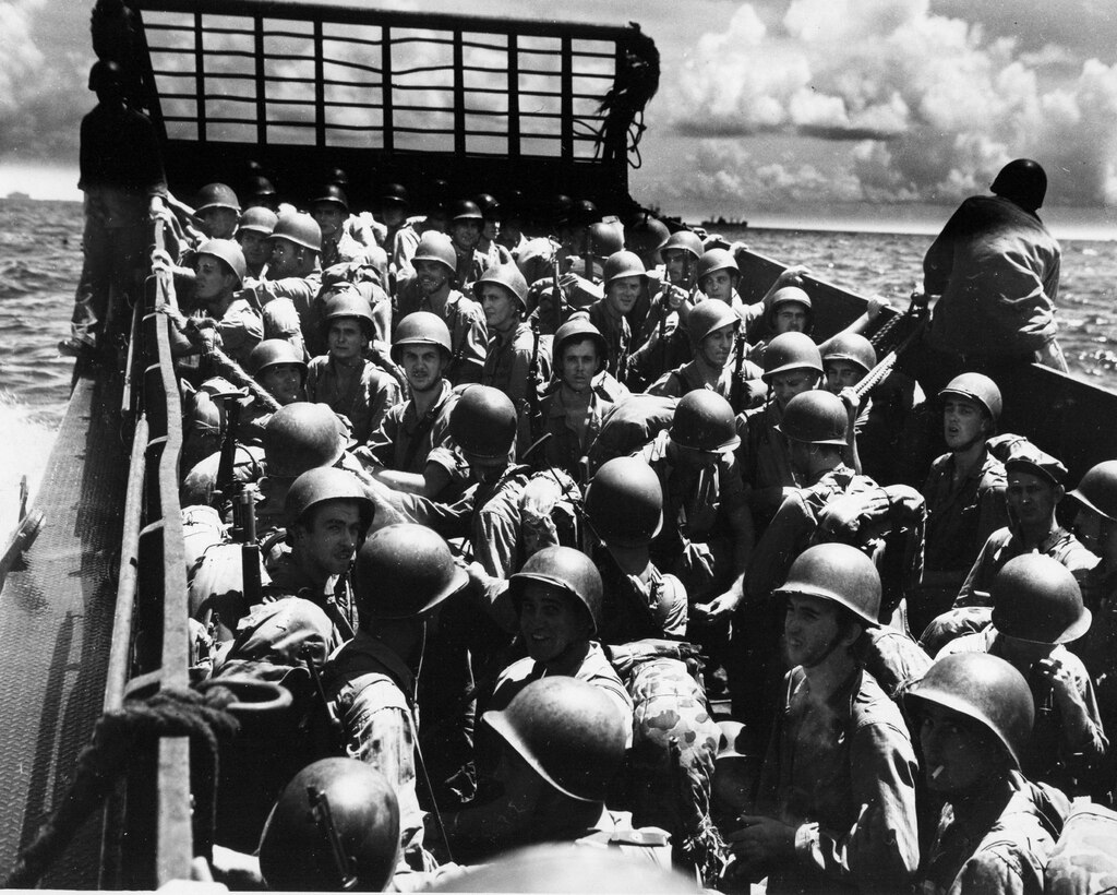 Marines prepare to storm the beaches on a landing craft just before the liberation of Guam July 21, 1944. Marine Corps Activity Guam Marines honored the sacrifice of those lost and celebrated with local residents in this year’s 69th Liberation celebration, which concluded Sunday with the Liberation Day Parade.  Each year, July is dedicated to preparing for and celebrating the liberation of the island from Japanese occupation during World War II.  (Official U.S. Marine Corps photo by Sgt. John Raufmann)  