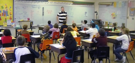 Spc. A.J. Richards of the North Dakota National Guard visits with third graders from Washburn Elementary School, during a recent leave from his mobilization to Kosovo. Richards is a Washburn-native and regularly corresponds with the class.