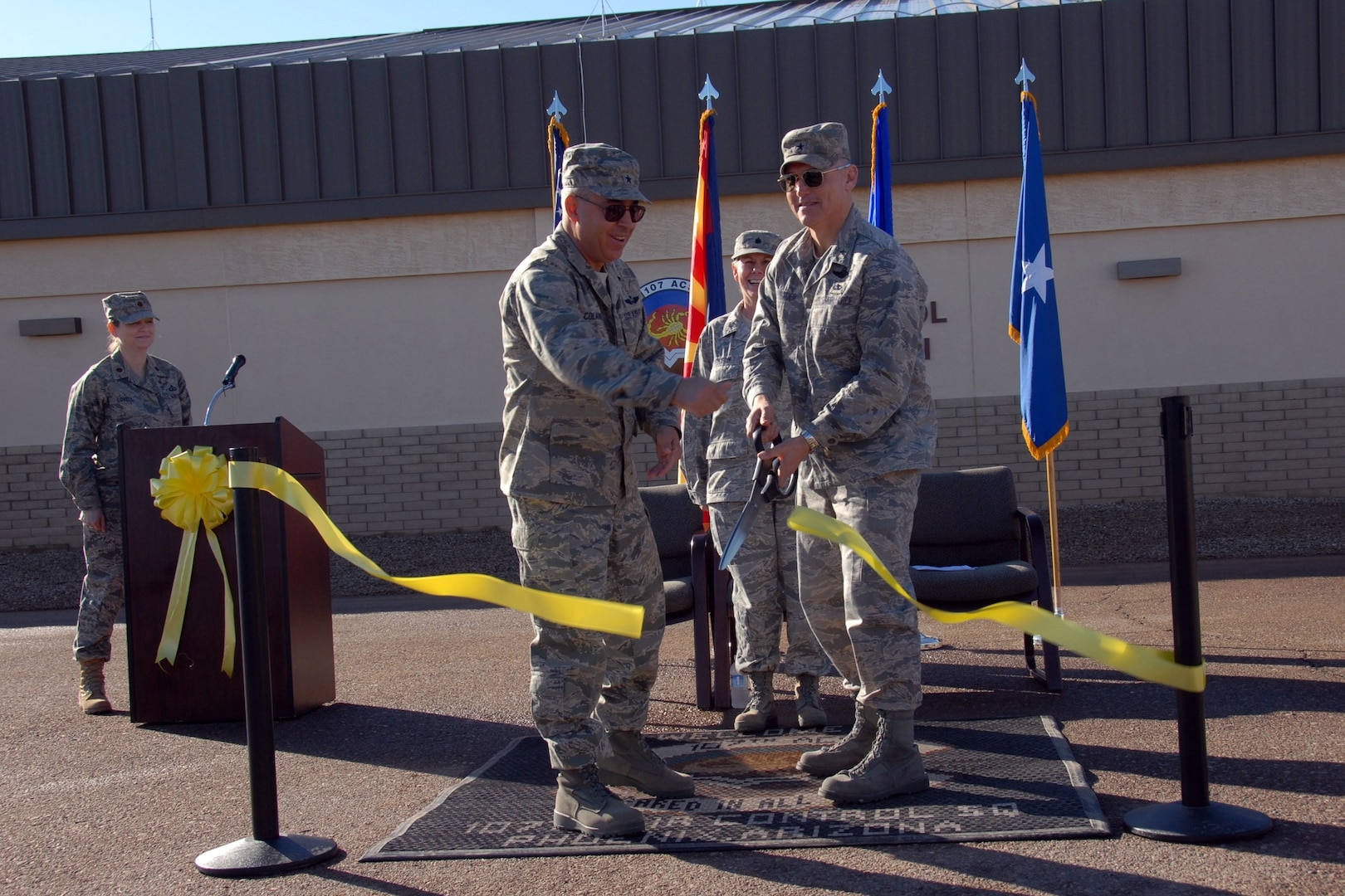 Brig. Gen. Michael Colangelo, Commander Ariz. Air National Guard, and Brig. Gen. Kurt Neubauer, Commander 56th Fighter Wing, cut the ribbon for the relocation of the 107th Air Control Squadron at Luke Air Force Base, Ariz, while Maj. Lynda Lovell and Lt. Col. Pamela Jackson, Commander 107th Air Control Squadron look on.