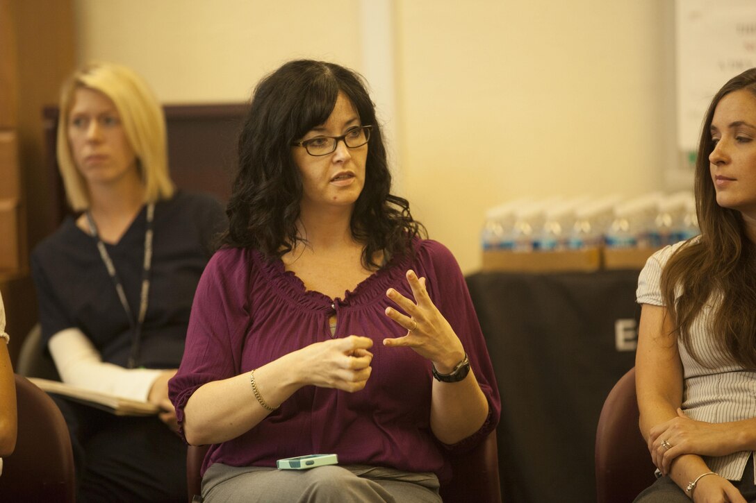 Dawn Wrenn, a certified trauma specialist with the Coastal Carolina Neuropsychiatry Center, speaks to participants about traumatic brain injuries and neurological disorders at an event hosted by the Exceptional Family Member Program at the Russell Marine and Family Center aboard Marine Corps Base Camp Lejeune, July 10. The Exceptional Family Member Program provides support to military families with special medical or educational needs.