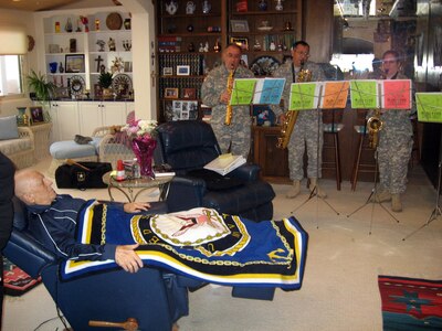 The "Darn Saxy" quartet of the New Mexico Army National Guard's 44th Army Band recently held a priviate concert for retired Col. Frank Hines, an 81-year-old Vietnam veteran, who served in both the Navy and the Air Force during his long military career.