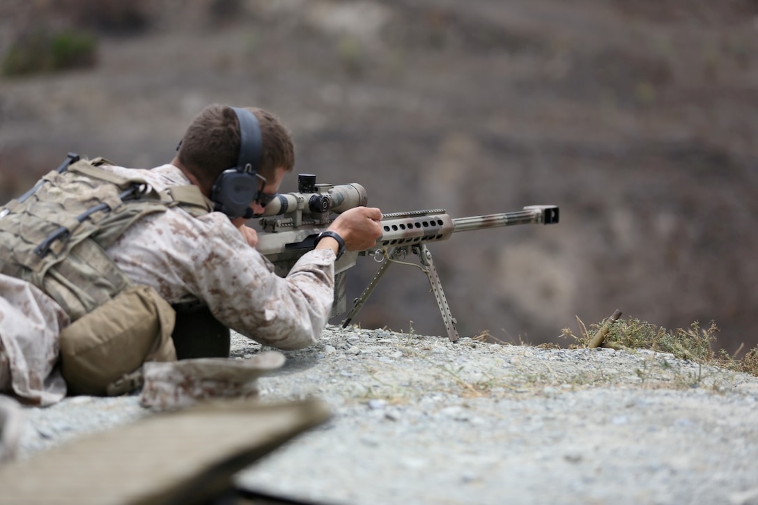 Corporal Bradley Cash, an antitank missileman serving with Delta Company, 1st Light Armored Reconnaissance Battalion, reloads his M107 Special Application Scoped Rifle during a SASR training course here, July 10, 2013. This is the first time Cash, a native of Lacrosse, Wis., has fired a .50 caliber sniper rifle. Upon completion of the course, he will be able to help train his fellow Marines on the employment of the rifle.