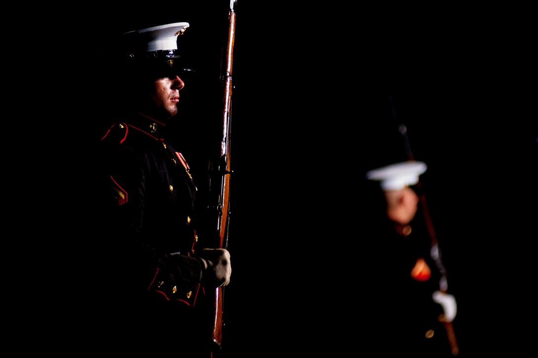 Members of the Marine Corps Silent Drill Platoon perform during a Friday Evening Parade at Marine Barracks Washington, D.C., July 19.