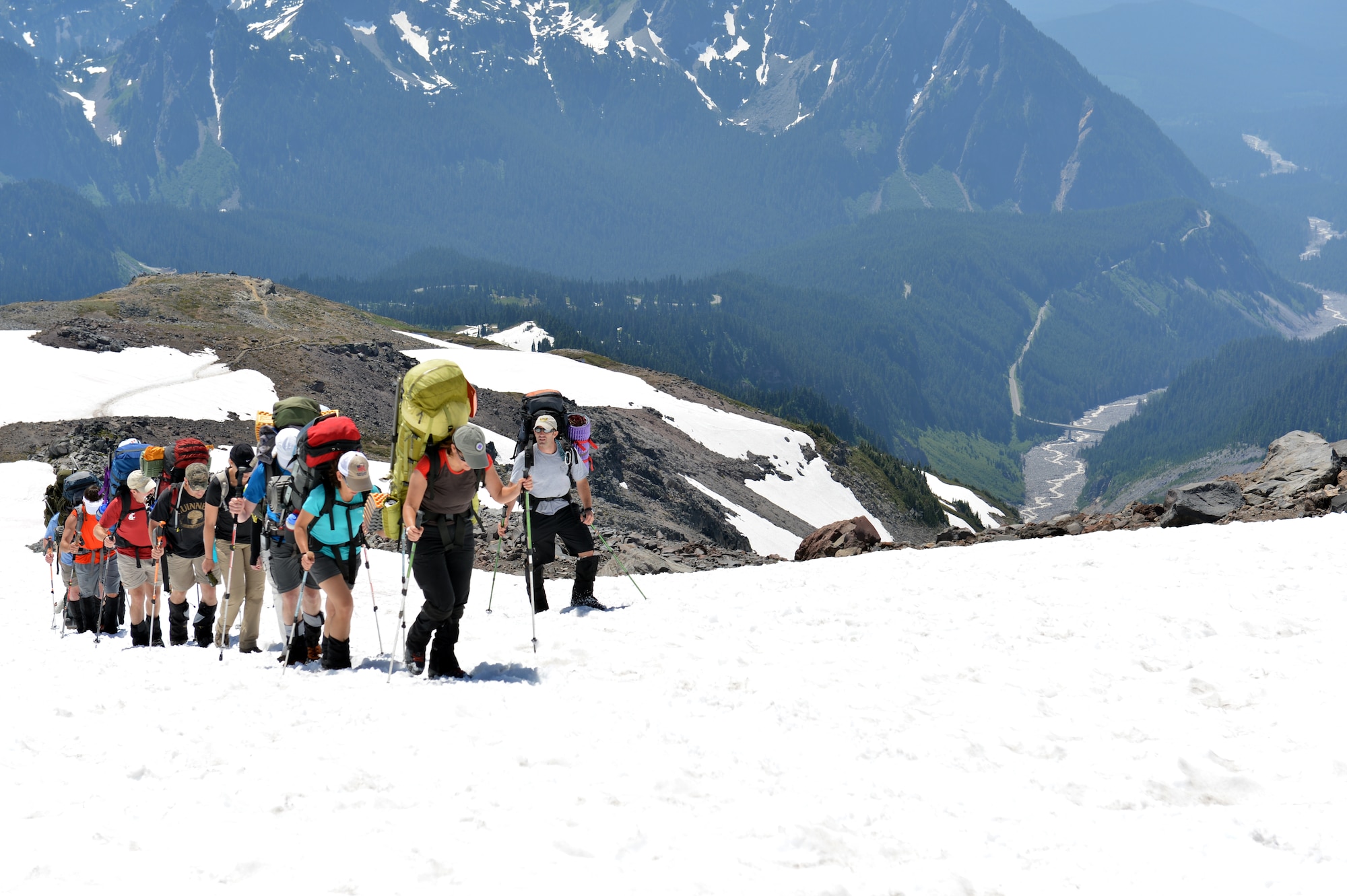 Maj. Mark Uberuaga, 88th Test and Evaluations Squadron pilot, team leader for the “Climbing for Warriors,” instructs climbers of proper footing techniques as the group ascends the Muir Snow Field, July 20, 2013 at Mount Rainier, Wash. Uberuaga is a native of Ashford, Wash., and grew up climbing Mount Rainier. (U.S. Air Force photo/Staff Sgt. Jason Truskowski)