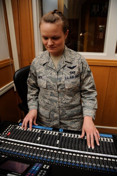 Senior Airman Alisha Smith, 2nd Bomb Wing Chaplain's Assistant, adjusts the chapel sound system in preparation for mass at Chapel 2 on Barksdale Air Force Base, La., July 22, 2013. Mass is held every Monday through Thursday at 11 a.m. and on Sundays at 9 a.m. (U.S. Air Force photo/Airman 1st Class Andrew Moua)