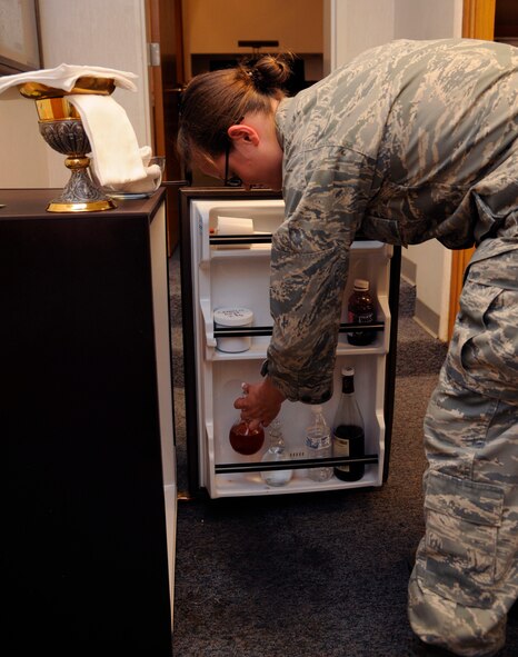 Senior Airman Alisha Smith, 2nd Bomb Wing Chaplain's Assistant, gathers materials for mass at Chapel 2 on Barksdale Air Force Base, La., July 22, 2013. Chaplains and Chaplain's Assistants are available for counseling to Airmen of all faiths. (U.S. Air Force photo/Airman 1st Class Andrew Moua)