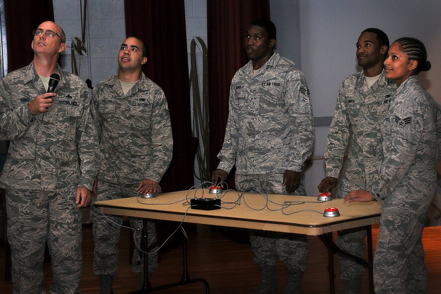 Chief Master Sgt. Bryan Ford, 512th Maintenance Group chief enlisted manager, and other 512th MXG Airmen participate in a back-to-basics challenge at Dover Air Force Base, Del., July 14, 2013. During the challenge, maintainers represented their squadrons and flights in head-to-head battles that tested their Air Force knowledge and abilities. (U.S. Air Force photo/Senior Airman Joe Yanik)
