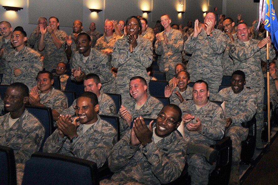 512th Maintenance Group Airmen erupt in applause during a back-to-basics challenge at Dover Air Force Base, Del., July 14, 2013. During the challenge, maintainers represented their squadrons and flights in head-to-head battles that tested their Air Force knowledge and abilities. (U.S. Air Force photo/Senior Airman Joe Yanik)
