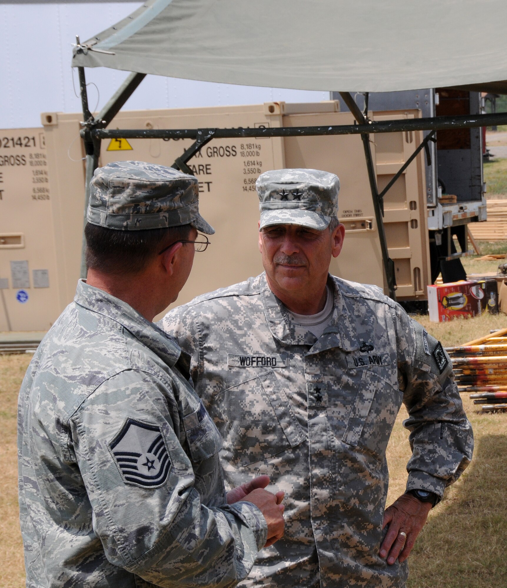 Maj. Gen. William Wofford, Arkansas National Guard adjutant general, visits with members of the 188th Civil Engineer Squadron at the unit’s urban search and rescue training facility July 15 during a command visit to the 188th Fighter Wing. (U.S. Air National Guard photo by Senior Airman John Hillier/188th Fighter Wing Public Affairs)