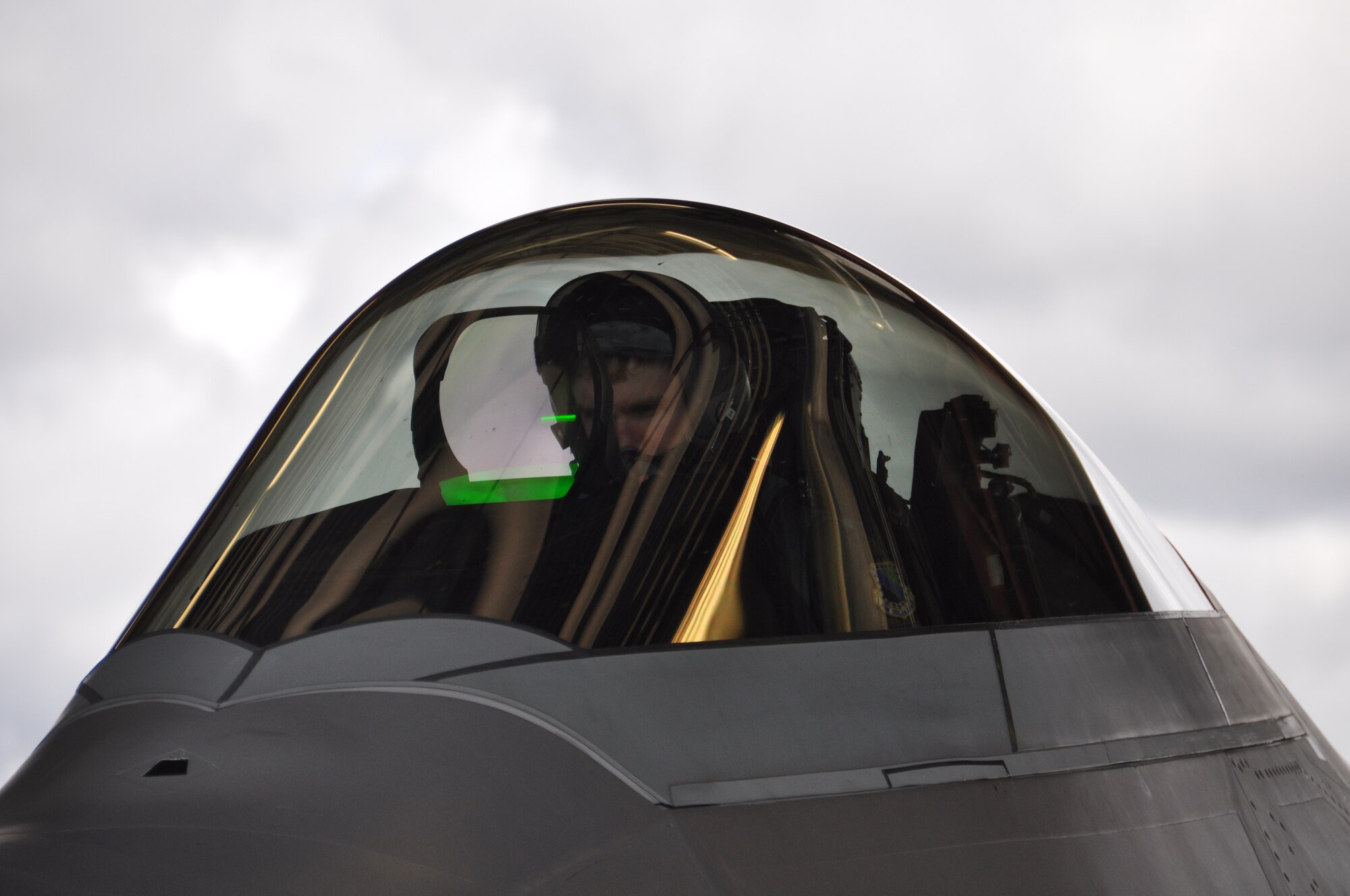 Capt. Brett Vongroven, 525th Fighter Squadron F-22 pilot, conducts final checks just prior to shutting down after his flight July 17. Vongroven was part of the aggressors flying in the 3rd Wings Turkey Shoot here July 17. (U.S. Air Force Photo/Tech. Sgt. Dana Rosso)