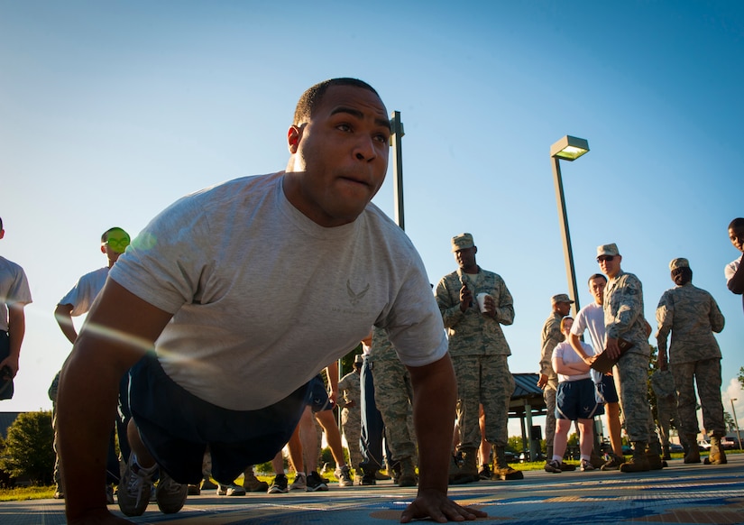 Senior Airman Kyle Coverdale, 437th Maintenance Squadron Aerospace Ground Equipment benchstock monitor, performs push-ups July 19, 2013, at the Dorm Challenge at Joint Base Charleston - Air Base, S.C. The quarterly competition is a Wing initiative intended to encourage resident interaction and camaraderie as part of Comprehensive Airman Fitness.  The Dorm Challenge consisted of push-ups, sit-ups, and games of cornhole and basketball. (U.S. Air Force photo/Senior Airman Ashlee Galloway)