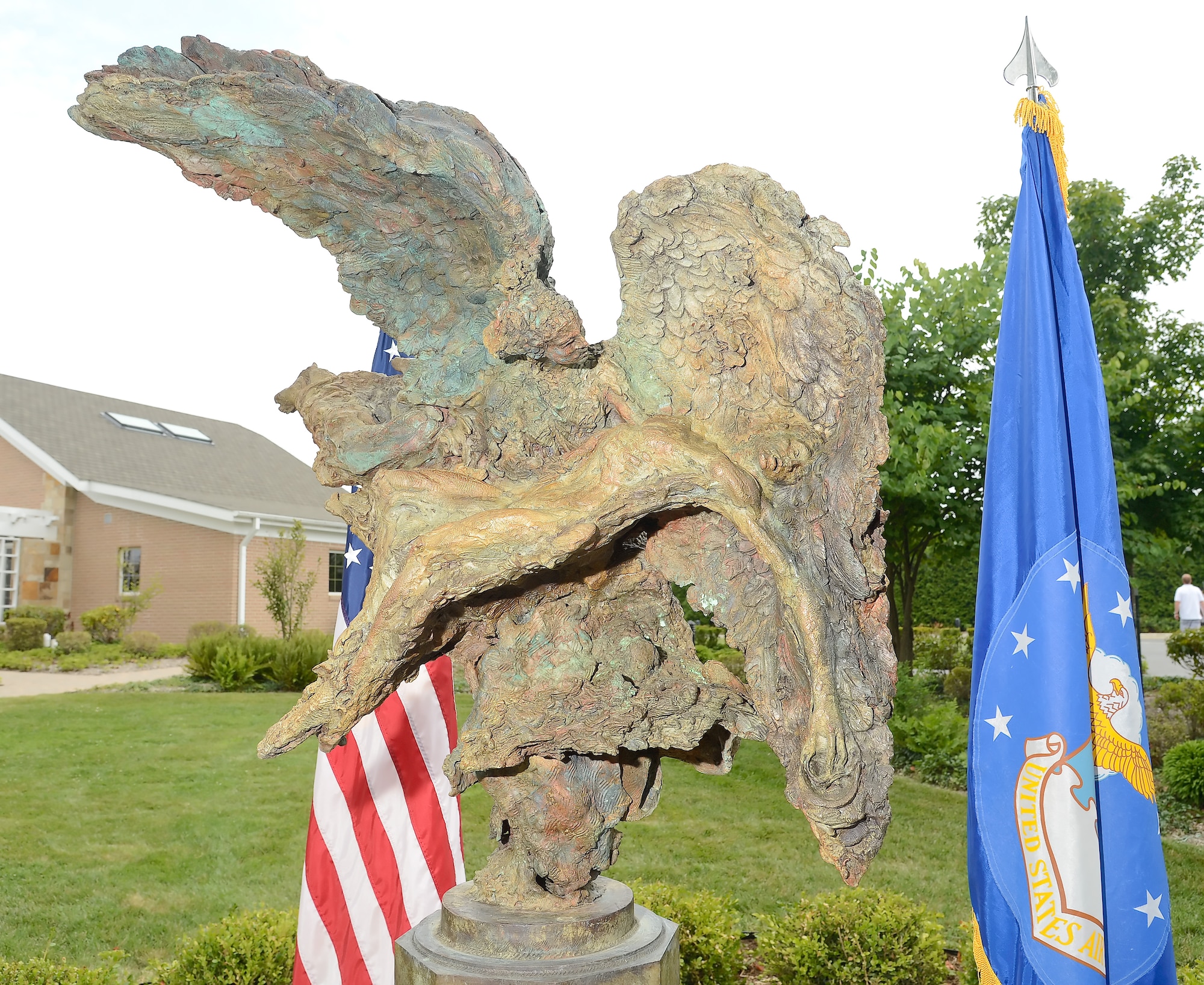 A bronze sculpture named The Angel and the Dying Unknown created by Mr. Greg Wyatt was unveiled in the meditation garden near the Fisher House on July 22, 2013 at Dover Air Force Base, Del. The sculpture was donated by the Newington-Cropsey Foundation, an organization that focuses on preserving and displaying art. (U.S. Air Force photo/Greg L. Davis)