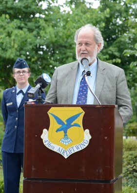 Mr. Greg Wyatt, sculptor of The Angel and the Dying Unknown bronze sculpture speaks at the unveiling ceremony near the Fisher House on July 22, 2013 at Dover Air Force Base, Del. The sculpture was donated by the Newington-Cropsey Foundation, an organization that focuses on preserving and displaying art. (U.S. Air Force photo/Greg L. Davis)