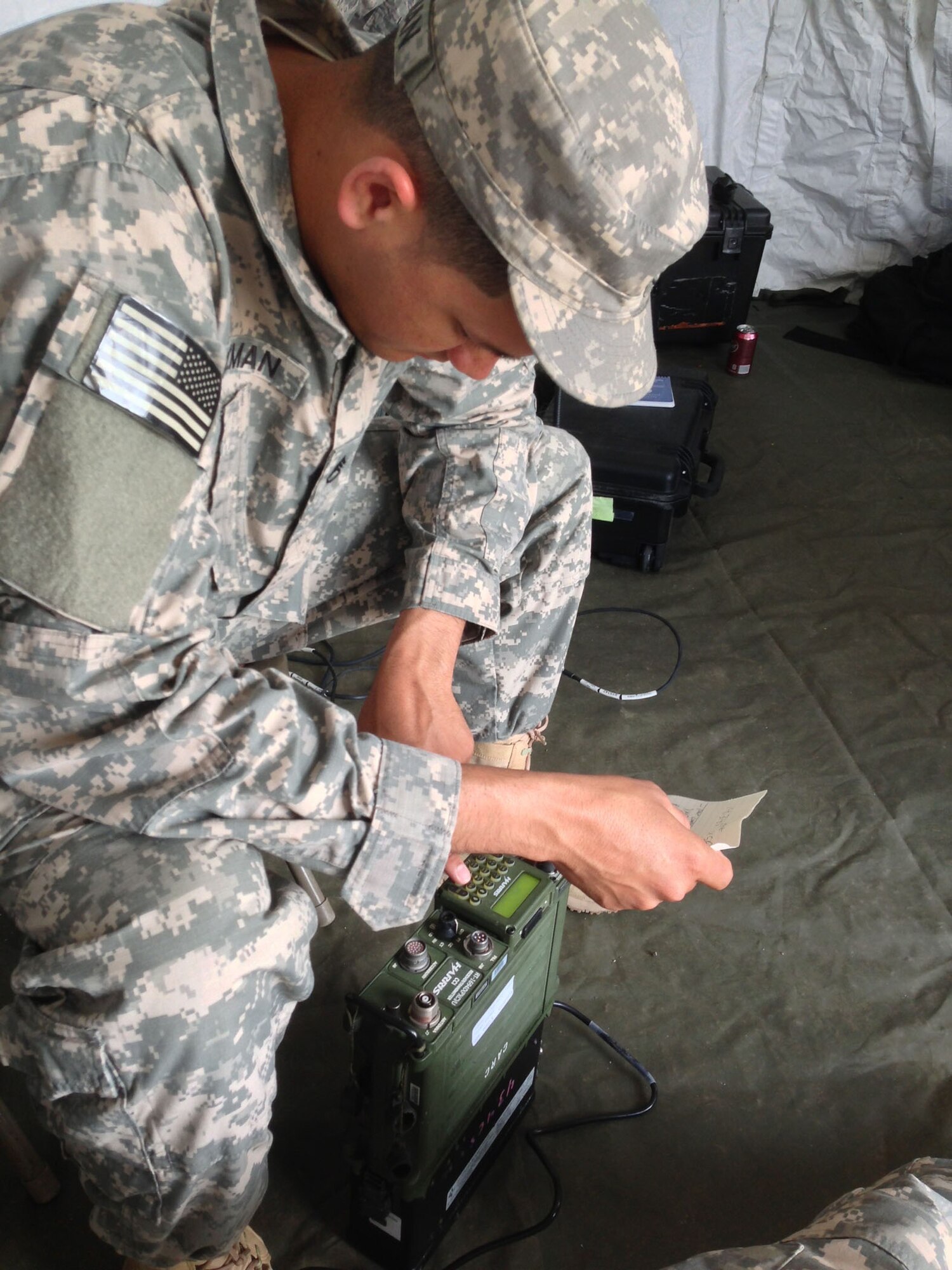 U.S. Army Staff Sgt. Jonathan Guzman, a member of the Joint Communications Support Element, configures a PRC-117G Wideband Tactical Radio for use during Vital Connection on May 15 and 16 in Littleton, Colo. JCSE provided commercial Internet, phone, video teleconferencing and radio communications on multiple channels and frequencies to over 60 personnel from local law enforcement and emergency response teams during the exercise. (Photo by U.S. Air Force Staff Sgt. Ricky Uth)