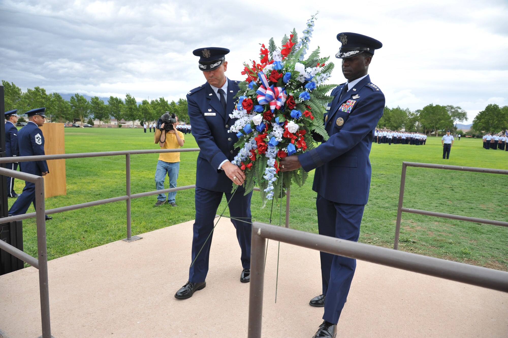 Gen. Edward Rice Jr., Air Education and Training Command commander, and Col. Vincent Becklund, 58th Special Operations Wing commander, place a wreath during a special remembrance and retreat ceremony July 15 at Hardin Field. The event honored 40 fallen Airmen who lost their lives while assigned to the wing since Sept. 11, 2001. (Photo by Ken Moore) 