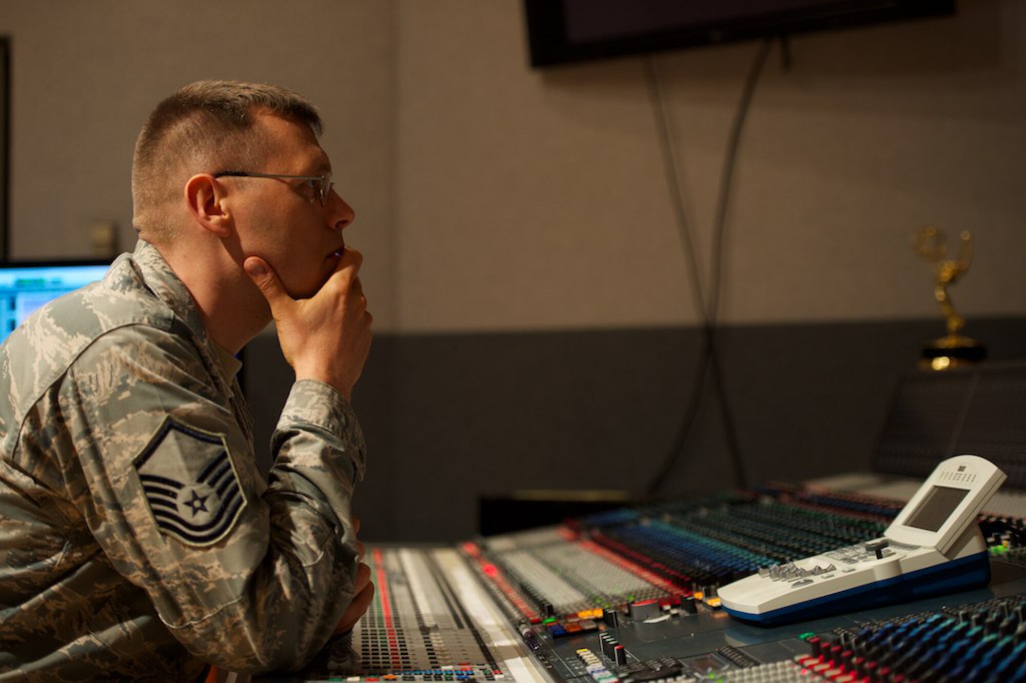 Master Sgt. James DeVaughn listens to a orchestral music recording July 3, 2013, at Bolling Air Force Base, Washington, D.C. When mixing songs in the studio, DeVaughn, an audio engineer and production assistant with The U.S. Air Force Band, listens to sections of songs, while making minute adjustments to the recording. Recently he received a regional Emmy® Award in recognition of his contribution to the audio track of a live Veteran's Day concert, which aired Nov. 11, 2012. (U.S. Air Force photo/Alexander W. Riedel)