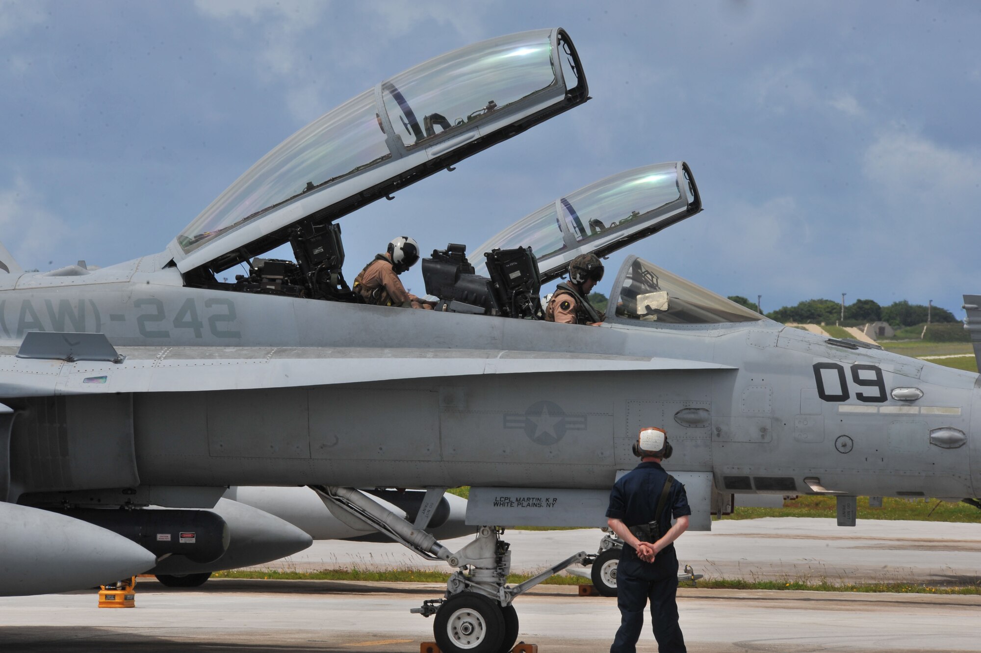 U.S. Marines deployed from the 533rd All-Weather Fighter Attack Squadron at U.S. Marine Corps Air Station Beaufort, S.C.,  inspect a F/A-18D Hornet on Andersen Air Force Base, Guam, July 19, 2013. The unit is on Andersen to take advantage of the area’s unique training ranges. (U.S. Air Force photo by Airman 1st Class Adarius Petty/Released)