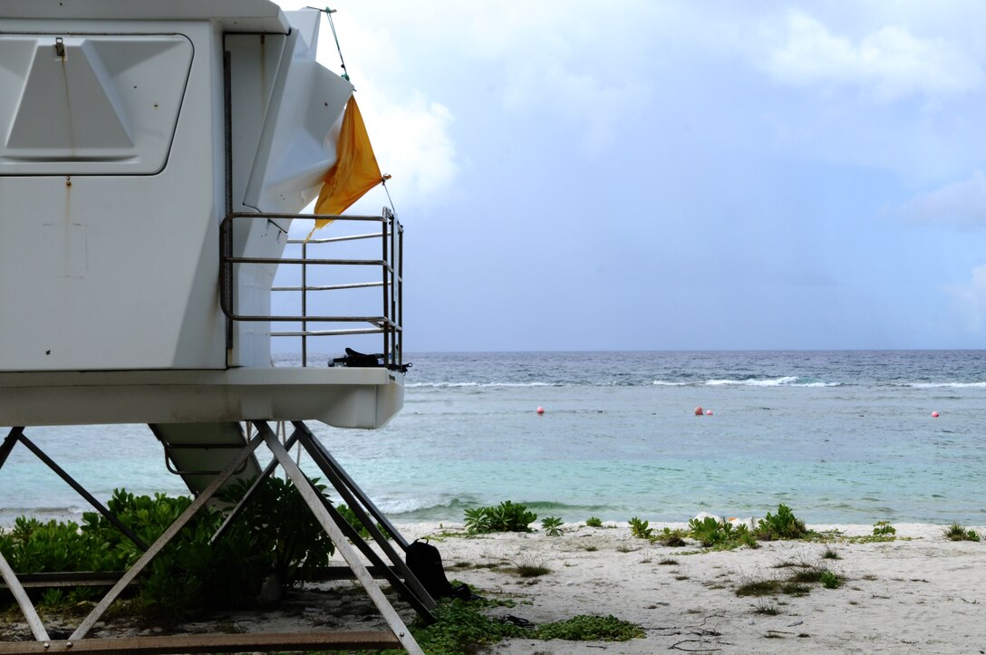 The yellow flag signals calm waters to swimmers July 18, 2013, at Tarague Beach on Andersen Air Force Base, Guam. Swimmers at Tarague are advised no lifeguards are present at the beach and should swim in buoyed areas to avoid hazardous conditions such as strong currents and waves. (U.S. Air Force photo by Airman 1st Class Mariah Haddenham/Released)