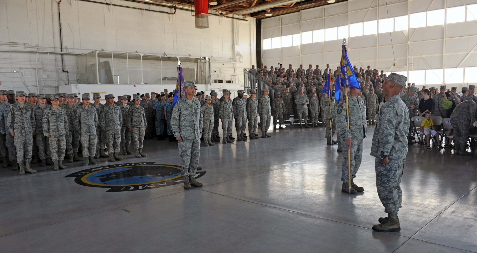 Personnel from the 366th Maintenance Group stand at attention during the change of command ceremony July 22, 2013, at Mountain Home Air Force Base, Idaho. These Airmen are responsible for aircraft, component and equipment maintenance as well as maintenance operations for the 366th Fighter Wing. (U.S. Air Force photo by Senior Airman Benjamin Sutton/Released)